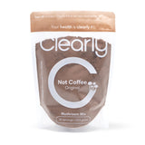 Clearly Not Coffee powder, a natural coffee alternative, shown in a close-up image highlighting the powder's texture and packaging.
