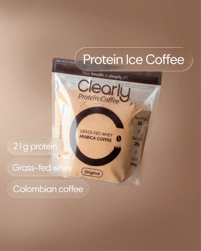 Clearly Protein Iced Coffee in a clear glass, showcasing a chilled coffee beverage with ice and a creamy layer on top.