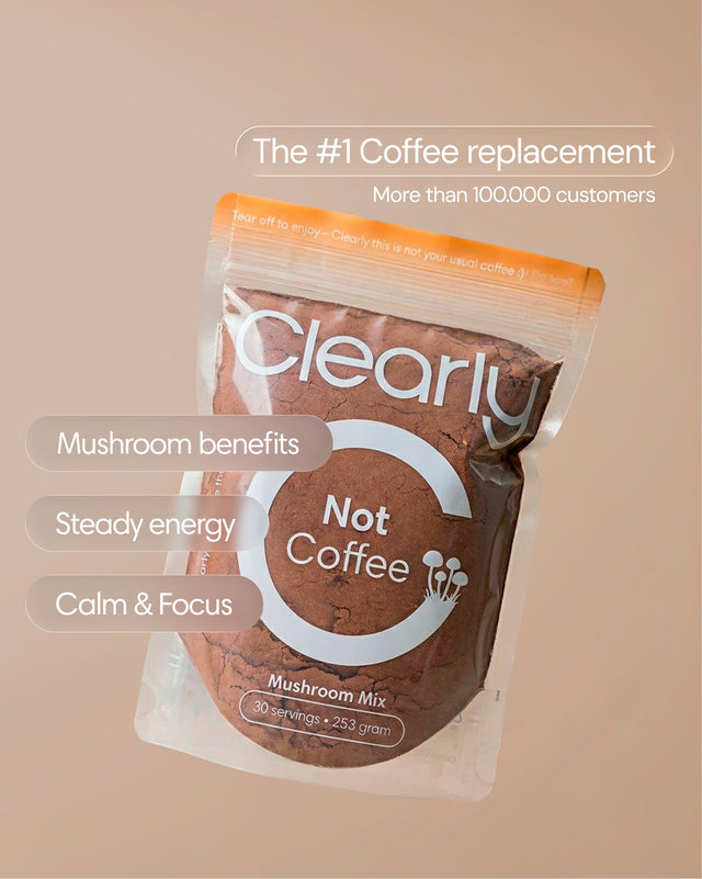 Clearly Not Coffee powder in a jar, showing the light brown textured powder inside on a white background.